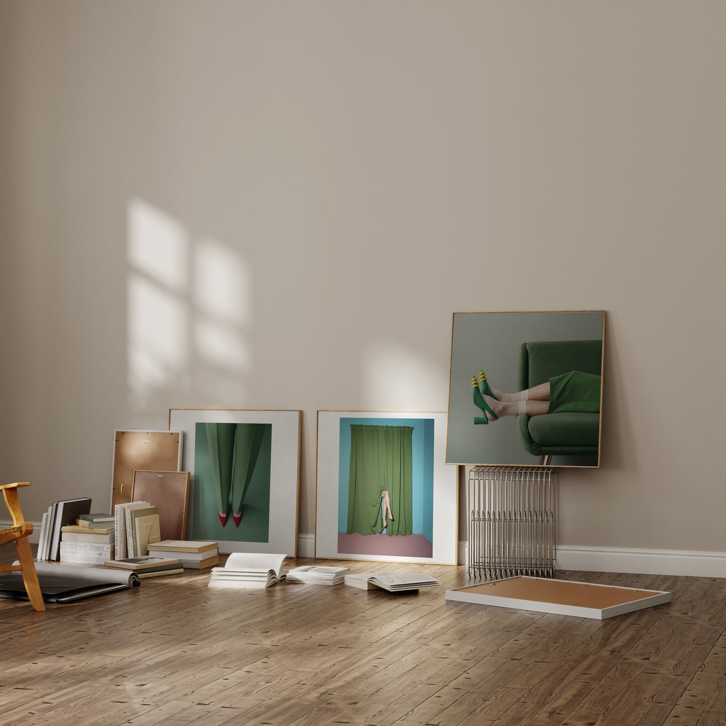 Various framed posters on the floor of a sunlit room.