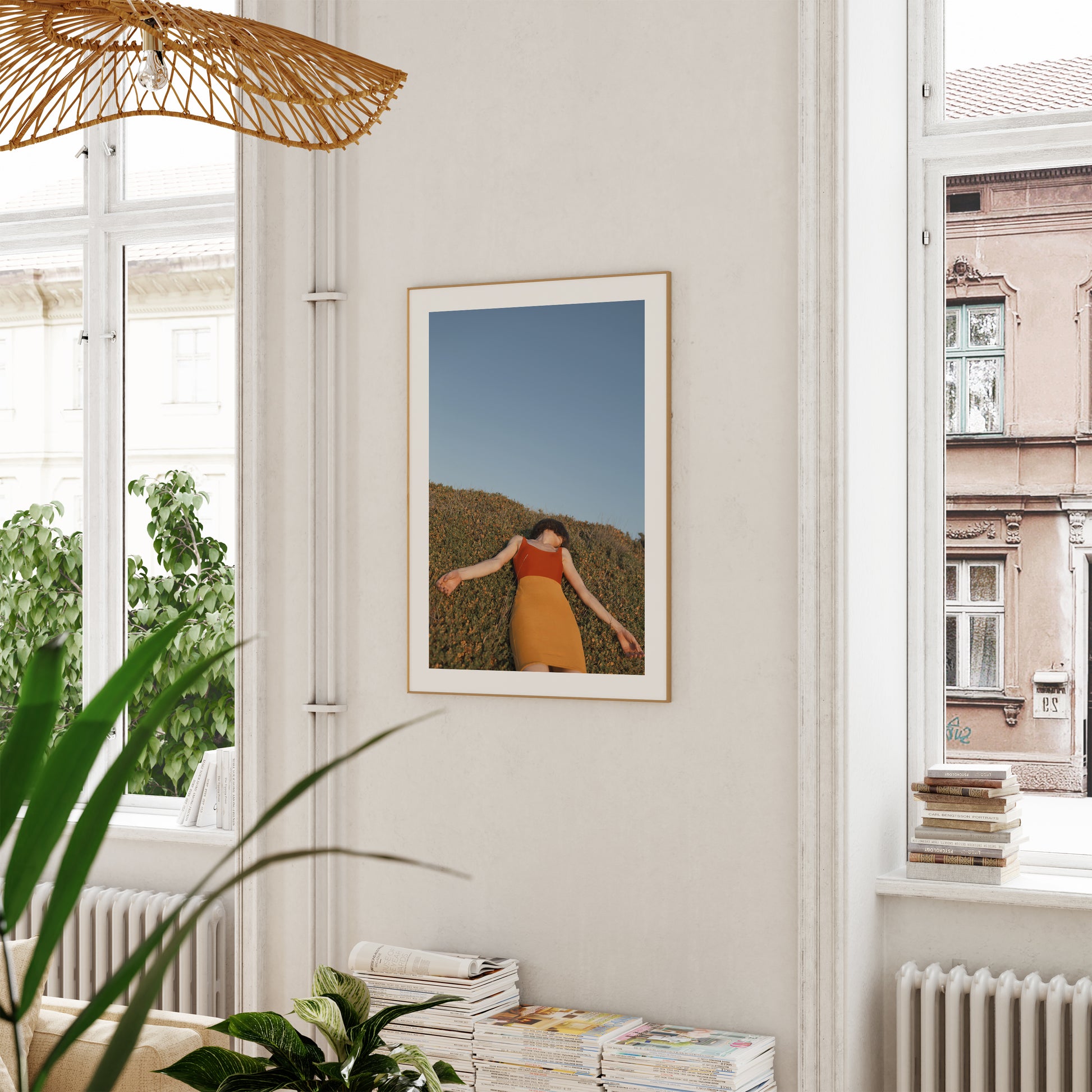 Wooden framed of a poster of model enjoying a hot summer day, hanged on a wall.